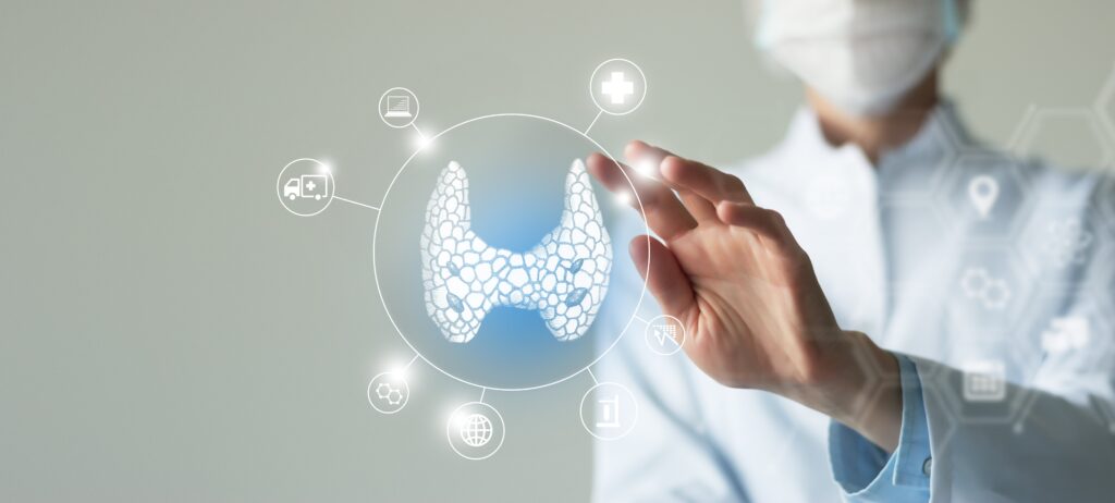 A sinus doctor holding shield and graphic virtual visualisation of Thyroid Gland organ - Dr. Leslie Koh