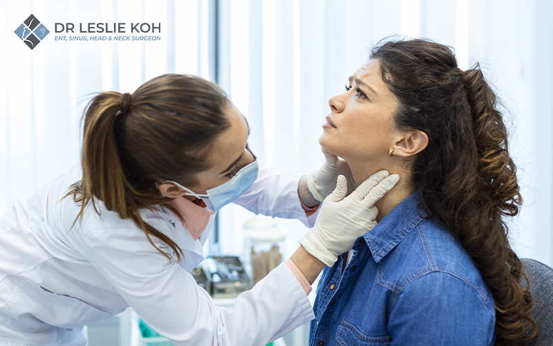 woman getting her thyroid checked