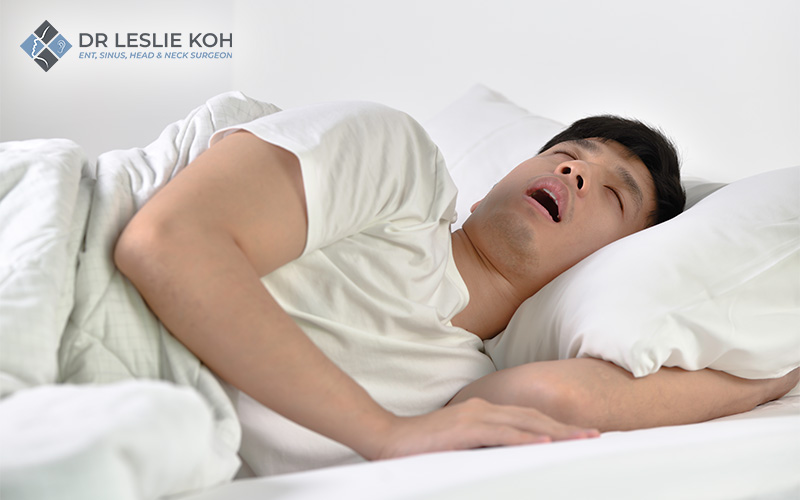 man sleeping and snoring loudly