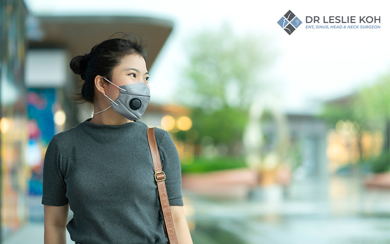 woman wearing a mask in the street