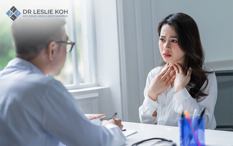 lady consulting a doctor for throat problems