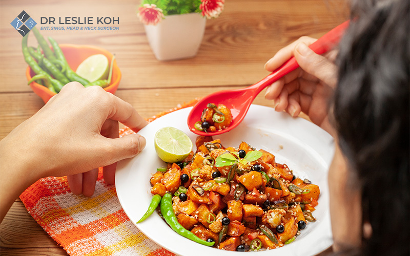 person eating a spicy meal.